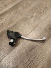 1976 Kawasaki KE175 Front Brake Lever Assembly 46094-011-21 Used. Price: $20.00.